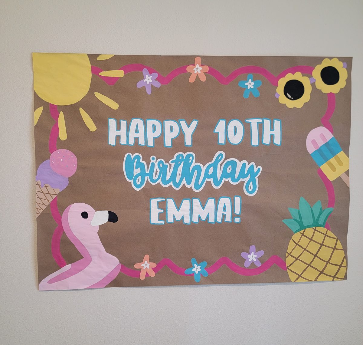 Happy 10th Birthday Emma summer-themed hand-painted banner with flamingo, pineapple, and ice cream
